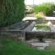 P&eacute;ronne-lavoir 4 dans hameau Saint Pierre de Lanques